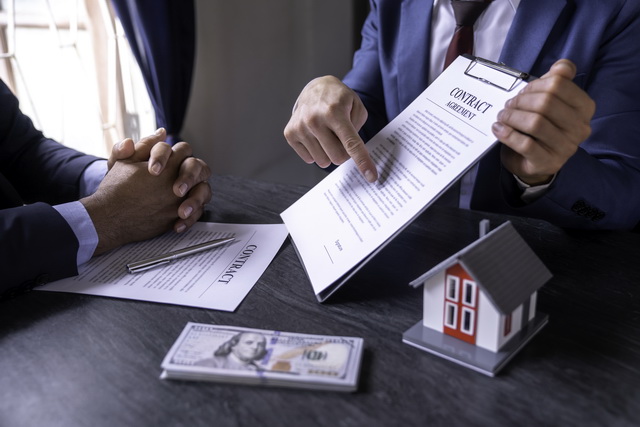 A couple reviewing mortgage loan options with a financial advisor, showcasing flexible solutions for home buying and refinancing.